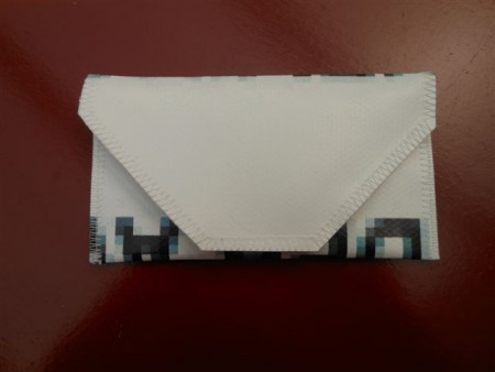 TA-004  7 euro telefoontasje met vakjes Buitenmaat: 15 cm breed, 8 cm hoog.